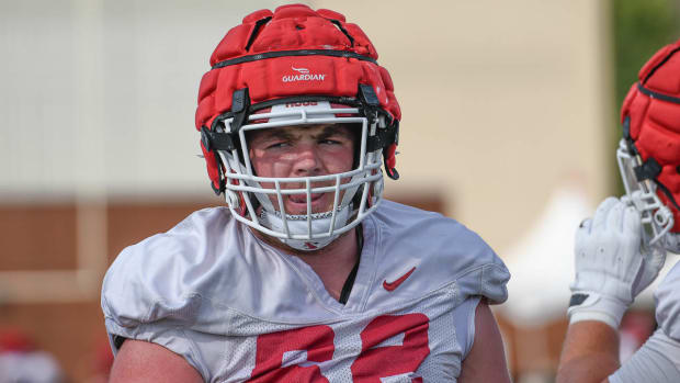 Razorbacks' offensive lineman Brady Latham at practice outside Tuesday